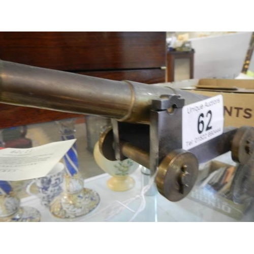 62 - A brass cannon.