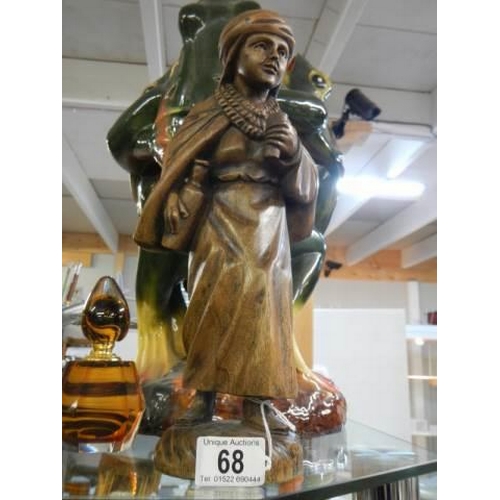 68 - A carved wood figure.