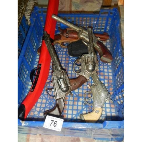 76 - A quantity of vintage toy guns.