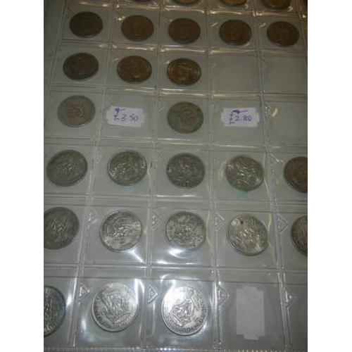 130 - A boxed coin album and mixed coins.