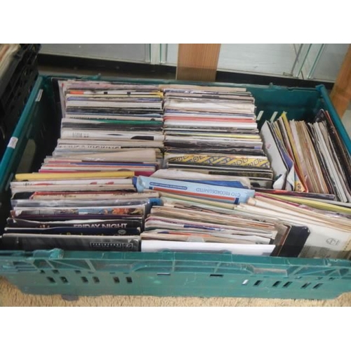 135 - Three large trays of 45 rpm records.