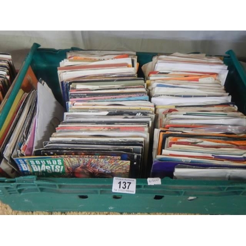 137 - Three large trays of 45 rpm records.