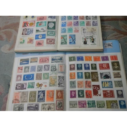 185 - Three albums of postage stamps.