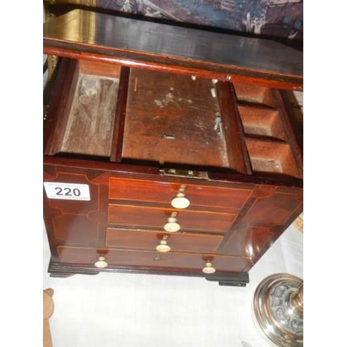 220 - A mahogany inlaid work chest with lift up lid.