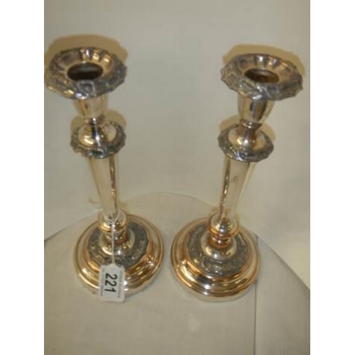 221 - A pair of Sheffield plate candlesticks.