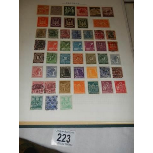 223 - A album of postage stamps.