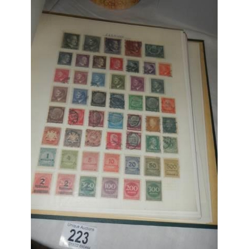 223 - A album of postage stamps.