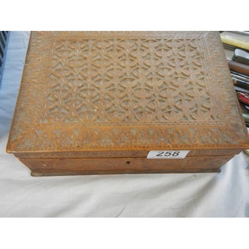 258 - A carved jewellery box and contents.