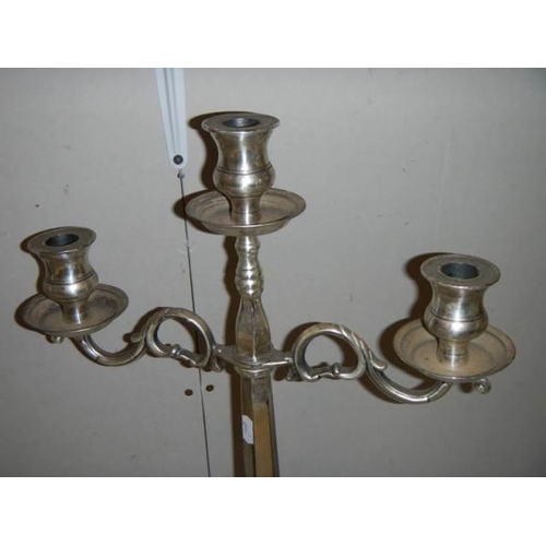 300 - A pair of modern silver plate candelabra.