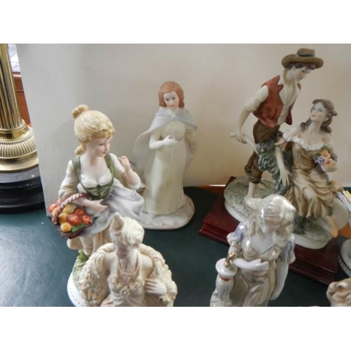 297 - A quantity of porcelain figures.