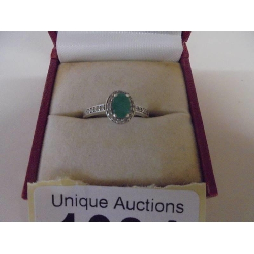 1034 - An oval top quality emerald and diamond ring set in yellow gold, size K half, 2.1 grams.