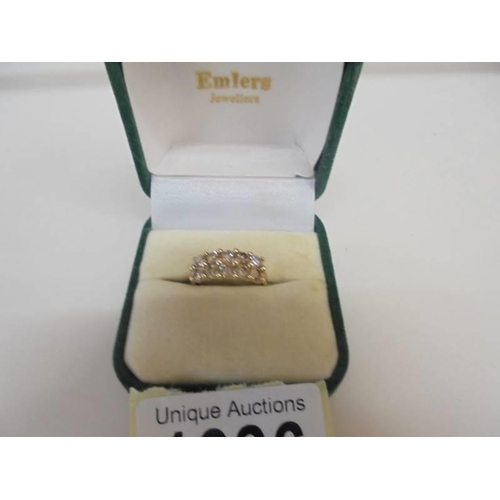 1036 - A twelve stone topaz ring set in yellow gold, size N, 2.8 grams.