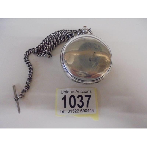 1037 - A Kays silver pocket watch on a silver chain, in working order.