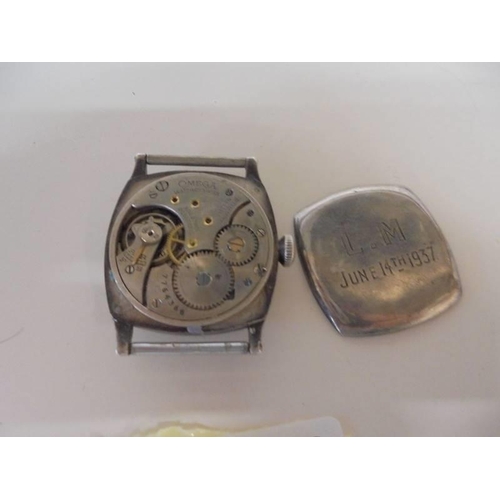 1038 - A circa 1930's Omega silver watch head, back loose and no strap.