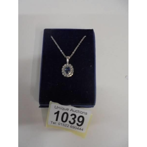 1039 - A white gold sapphire and diamond pendant, 3.8 grams.