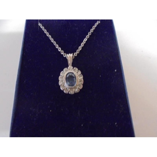 1039 - A white gold sapphire and diamond pendant, 3.8 grams.