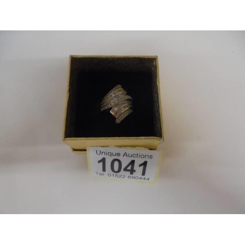 1041 - A seven row multi white gold diamond ring size K, 4.9 grams.