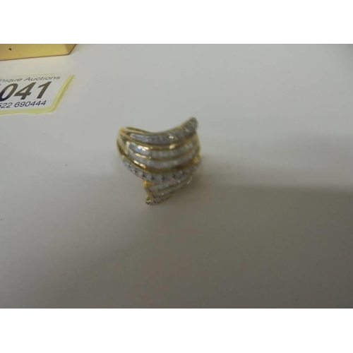 1041 - A seven row multi white gold diamond ring size K, 4.9 grams.