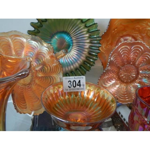 304 - Nine piece of carnival glass. COLLECT ONLY.