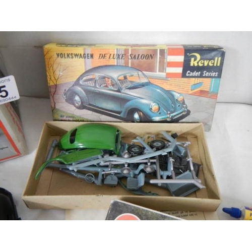 305 - Two Revell and one Airfix model car kits.