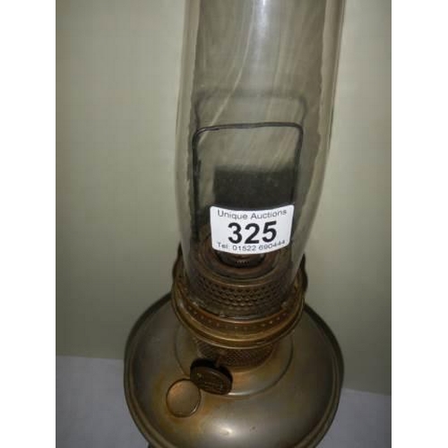 325 - A brass oil lamp with chimney.