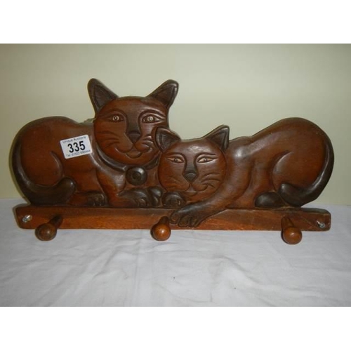 335 - A wooden cat shaped coat hook.