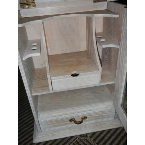 344 - A good quality limed oak smokers cabinet.