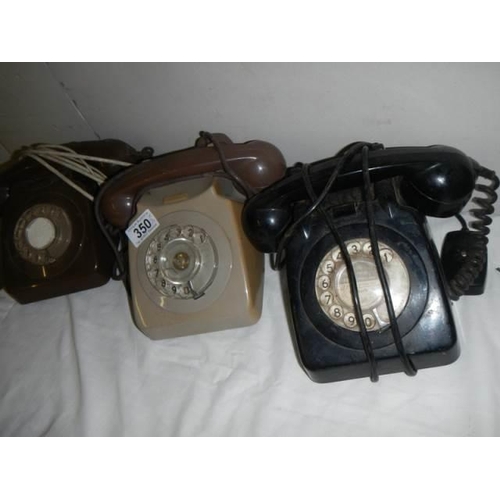 350 - Three vintage telephones.