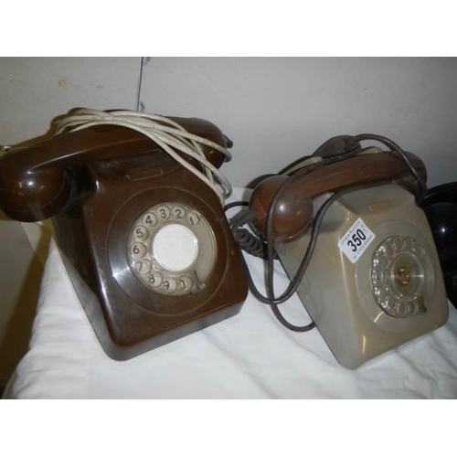 350 - Three vintage telephones.