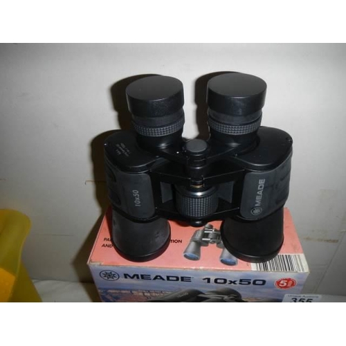 355 - A pair of boxed Meade 10 x 50 binoculars.