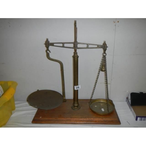 356 - A set of Victorian brass balance scales.