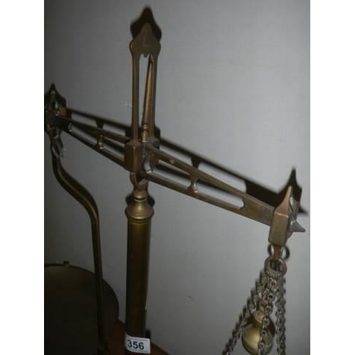 356 - A set of Victorian brass balance scales.