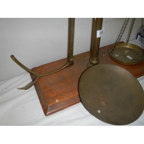 356 - A set of Victorian brass balance scales.