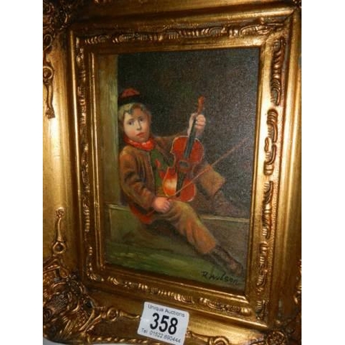 358 - A gilt framed study of a boy violinist.