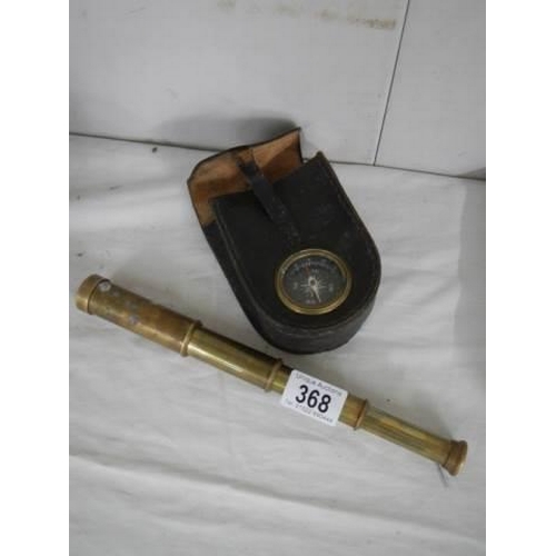 368 - A brass telescope and a compass.