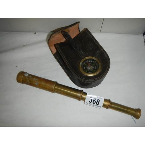 368 - A brass telescope and a compass.