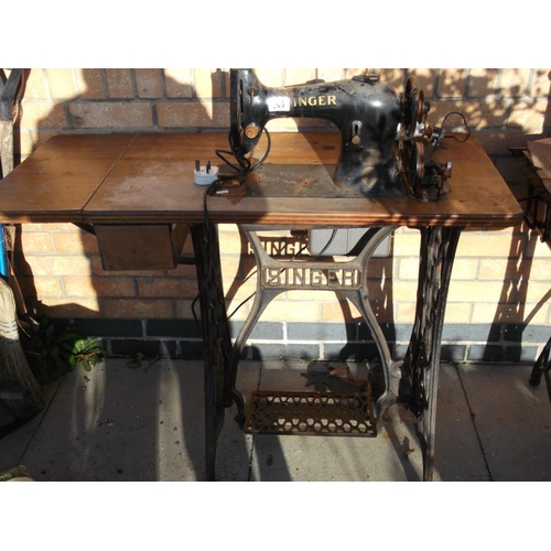 205 - An Electric Treadle Cast Base Sewing Machine