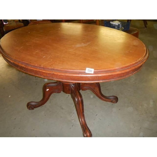 590 - A Victorian mahogany pedestal dining table. COLLECT ONLY.