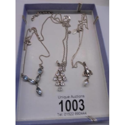 1003 - Three silver pendants.