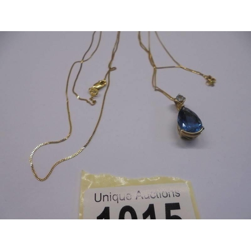 1015 - A 9ct gold blue stone pendant and another 9ct gold chain. 4.4 grams.