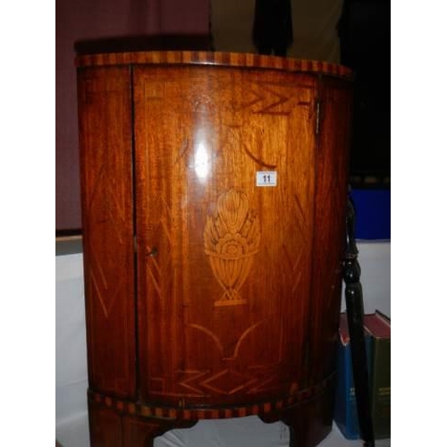 11 - A marquetry inlaid corner cupboard. (53cm x 37cm x 78cm high) COLLECT ONLY.