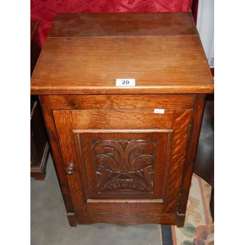 20 - A carved door pot cupboard, COLLECT ONLY.