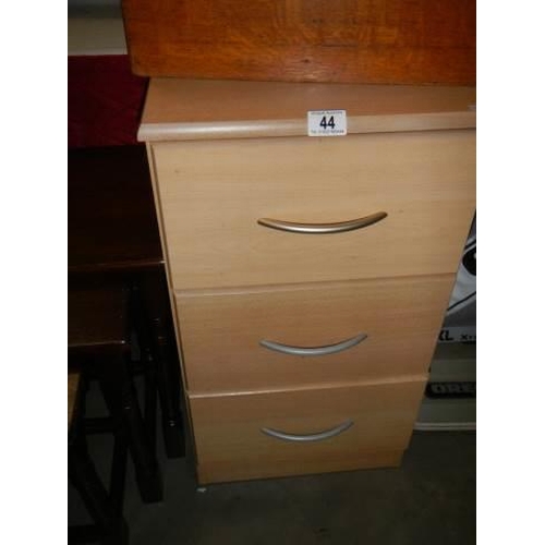 44 - A small three deep drawer bedroom chest, COLLECT ONLY.