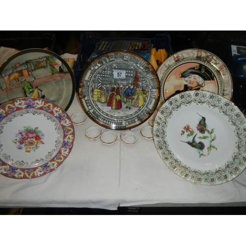 57 - 7 assorted collector's plates & 6 porcelain napkin rings