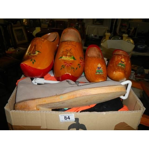 84 - A quantity of wooden clogs, other shoes & shoe stretchers.