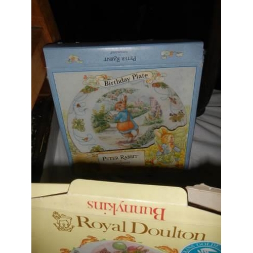 88 - A boxed Royal Doulton Beatrix Potter dish, two other items and Beatrix Potter videos.