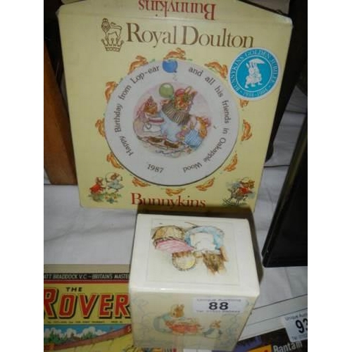 88 - A boxed Royal Doulton Beatrix Potter dish, two other items and Beatrix Potter videos.