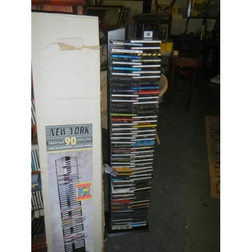 98 - A large quantity of CD's and two CD shelves. COLLECT ONLY.