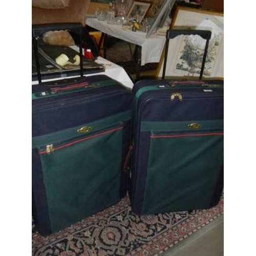 199 - Two wheelie suitcases, COLLECT ONLY.