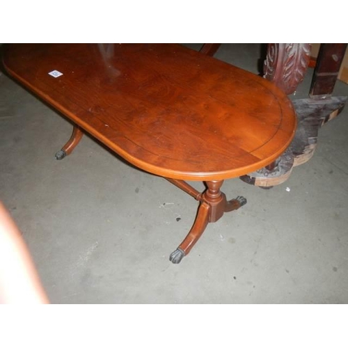 236 - An oval coffee table, COLLECT ONLY.